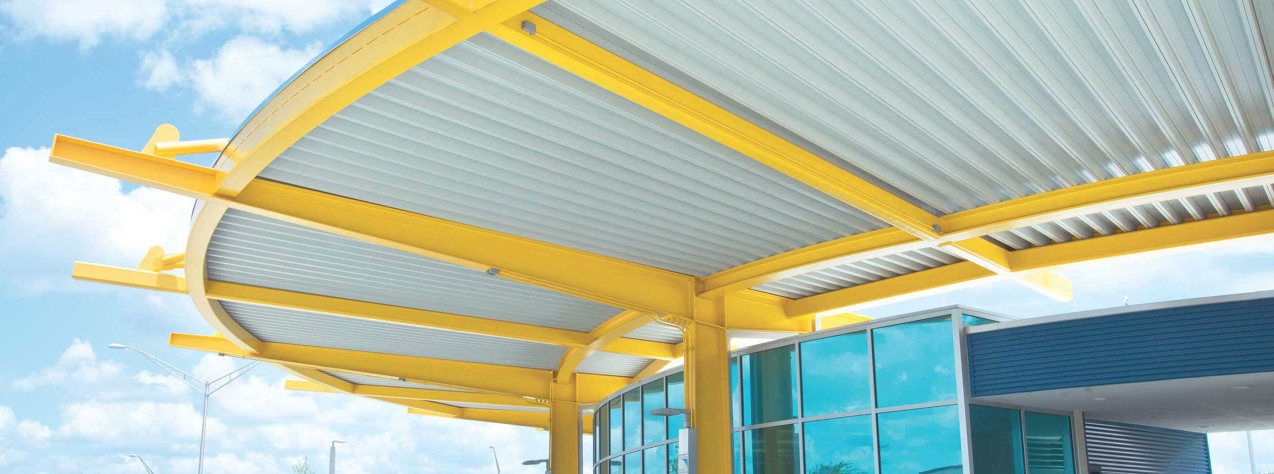 white metal canopy with yellow structural elements